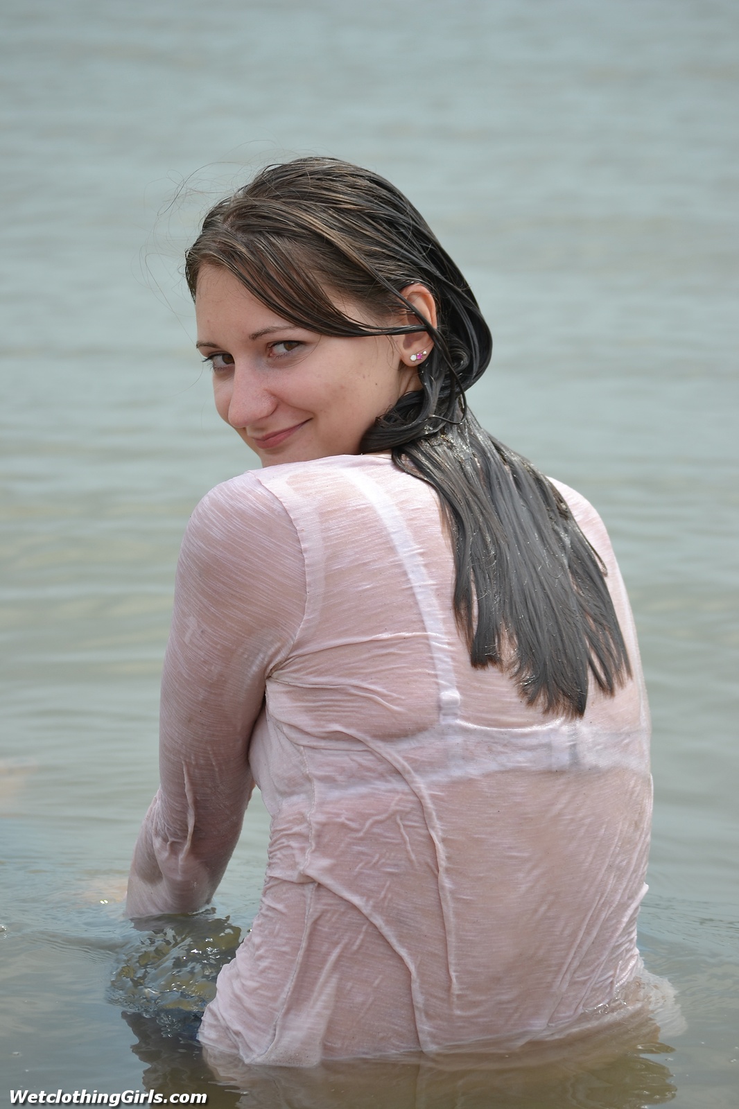 Martyna in a tight denim and a white shirt that gets c-thru when wet! 